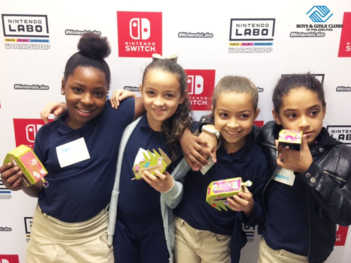 Four kids posing together